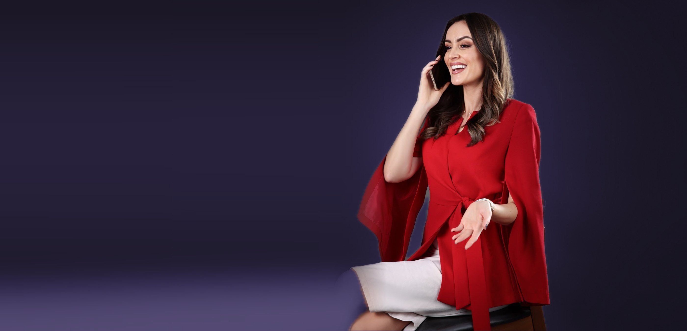 Mia Pavlikova laughing on a phone call in the studio
